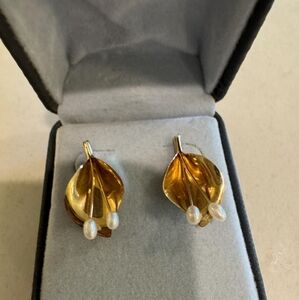 Carla 14 karat gold and pearl pierced earrings.